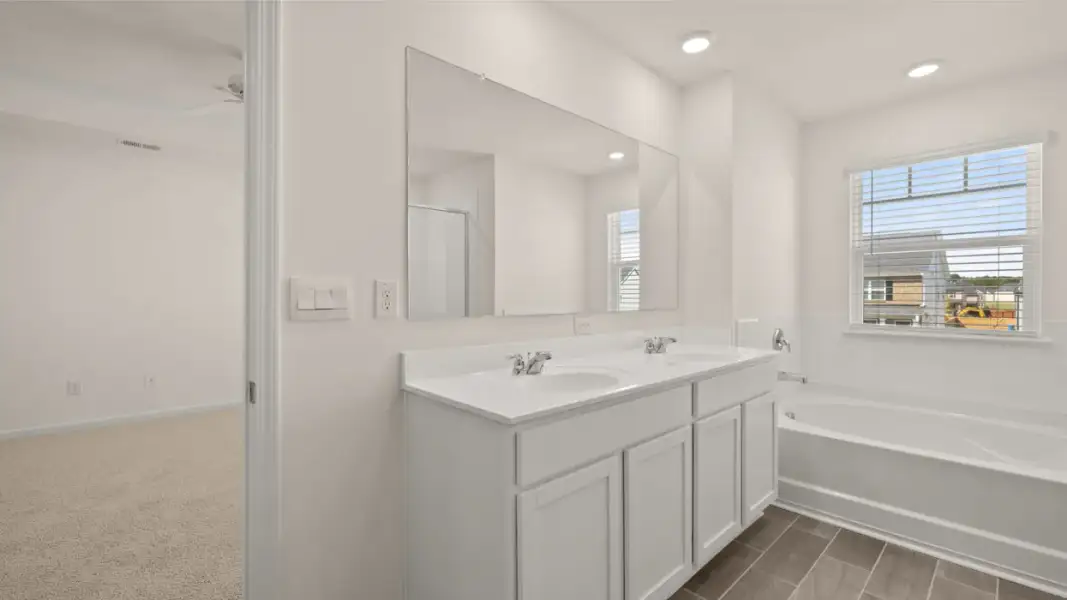 Furnished interior view inside a new home in The Highlands at Cedar Hill Landing, Navassa (Image 9).