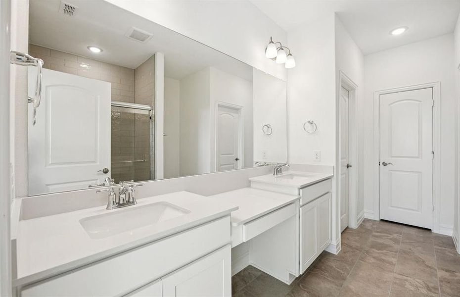 Owner's private bathroom with double vanity