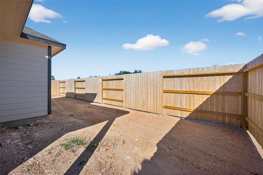 Exterior details and patio area of a home in Enclave at Willis, Willis (Image 4).