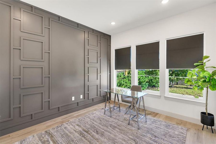 Office with light hardwood / wood-style floors