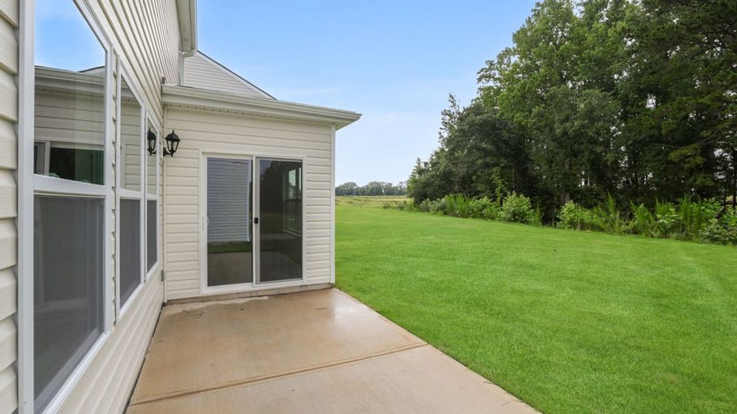 Exterior details and patio area of a home in Durbin Meadows, Fountain Inn (Image 20).
