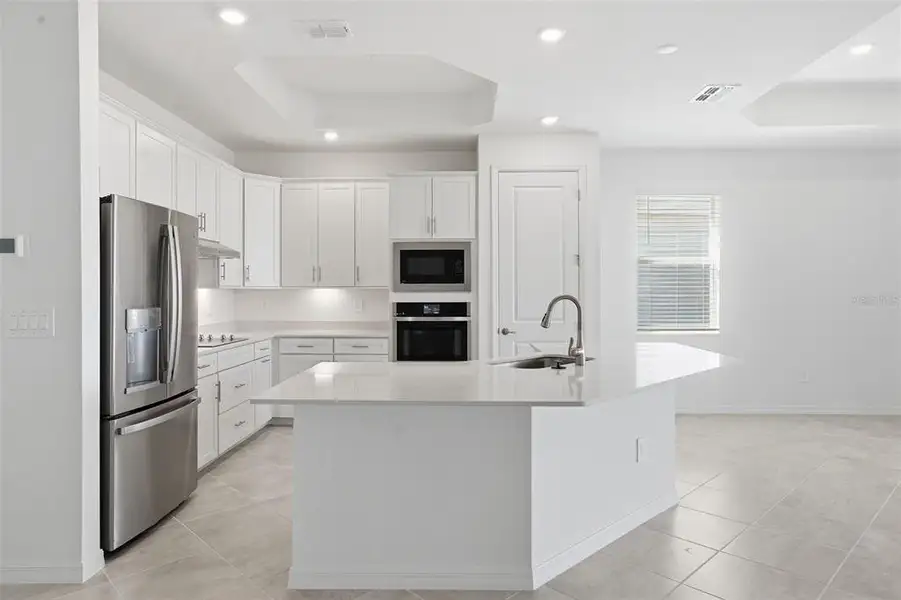 Furnished interior view inside a new home in Wellen Park Golf & Country Club, Venice (Image 10).