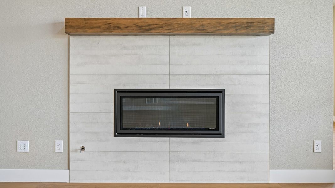 A fireplace adds warmth and character to the great room