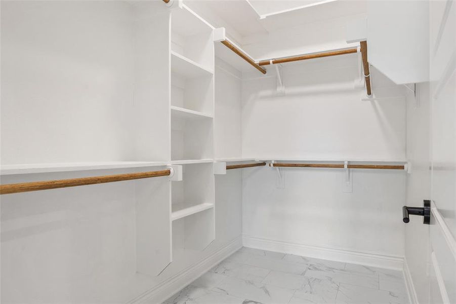 Spacious closet featuring light finish floors Spacious closet featuring light finish floors