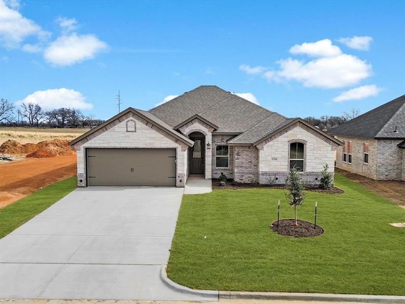 Front exterior of a new home in , Tolar, TX, highlighting curb appeal (Image 24). Front exterior of a new home in , Tolar, TX, highlighting curb appeal (Image 24).