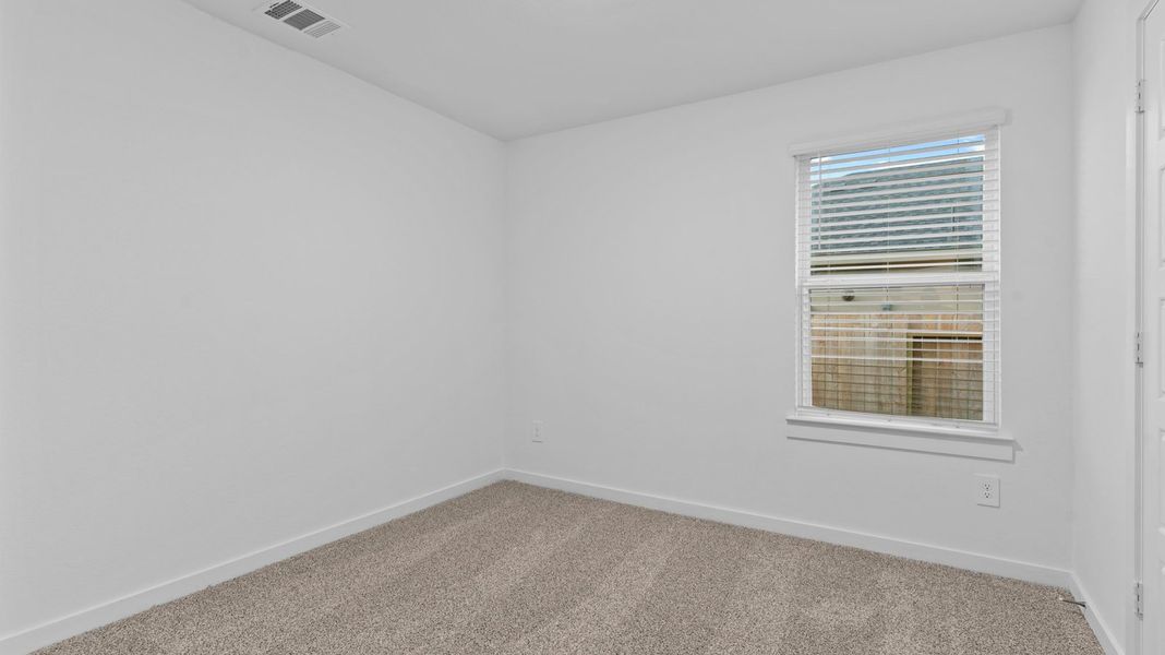 Spacious, unfurnished interior of a new home in Caldwell Crossing, Iowa Colony (Image 18).