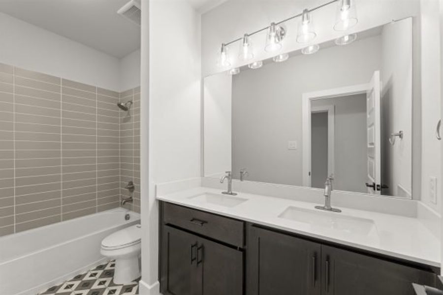 Representative furnished interior of a home built from the Tahiti by Stonefield Homes in Heath Golf and Yacht Club, Rockwall (Image 52).