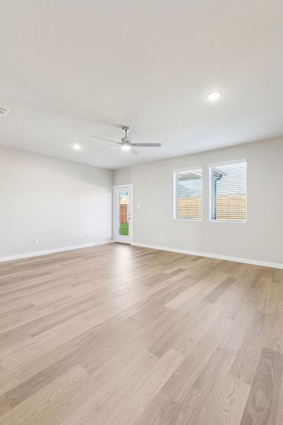 Living Room in the Haylee home plan by Trophy Signature Homes - REPRESENTATIVE PHOTO