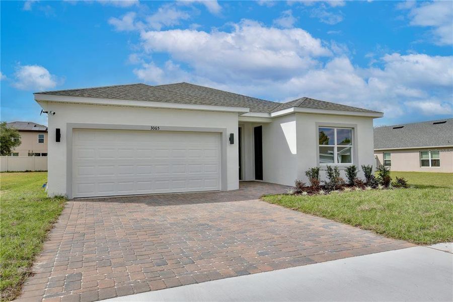 Front exterior of a new home in , Groveland, FL, highlighting curb appeal (Image 2). Front exterior of a new home in , Groveland, FL, highlighting curb appeal (Image 2).