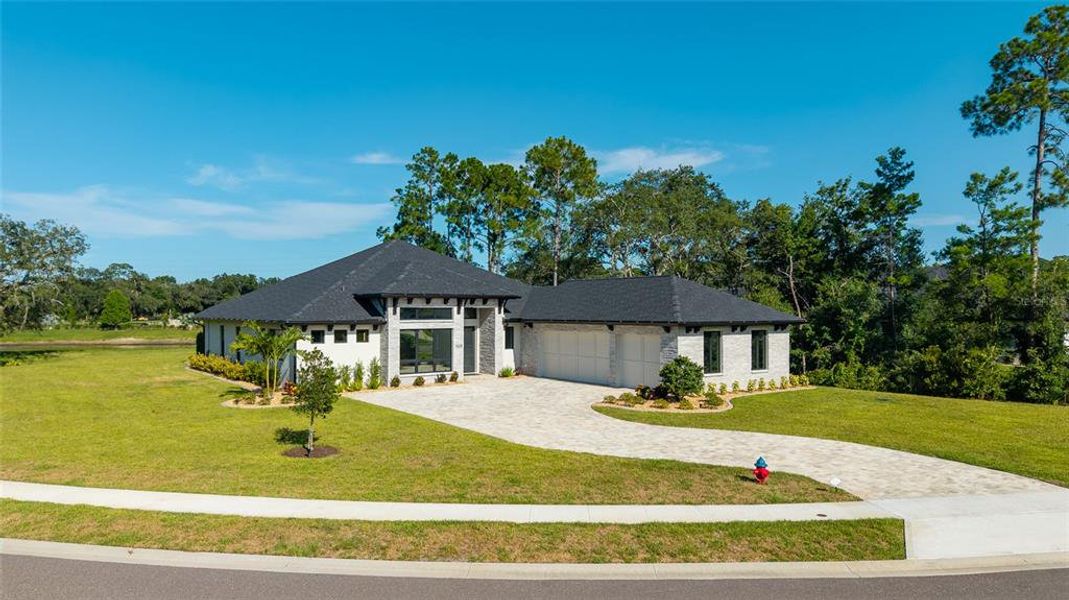 Front exterior of a new home in , New Smyrna Beach, FL, highlighting curb appeal (Image 27). Front exterior of a new home in , New Smyrna Beach, FL, highlighting curb appeal (Image 27).