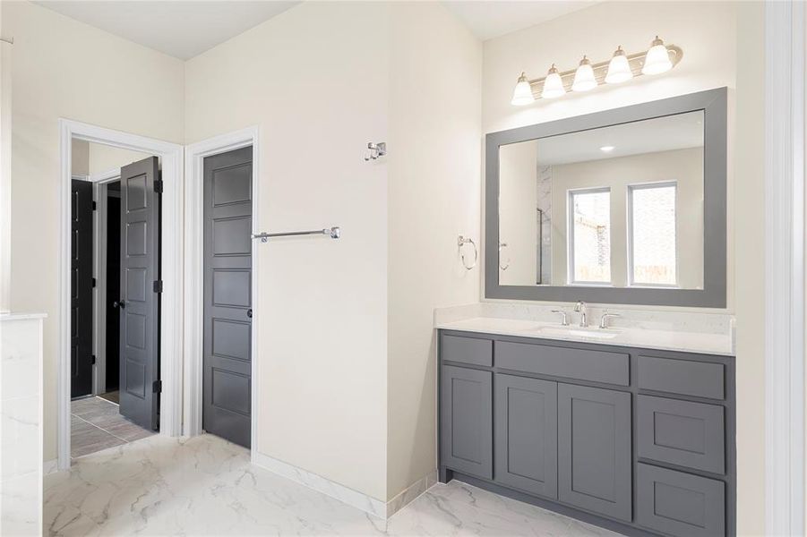 Bathroom featuring vanity and tile patterned flooring