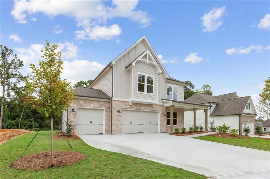 Front exterior of a new home in Ashbury Commons, Powder Springs, GA, highlighting curb appeal (Image 1). Front exterior of a new home in Ashbury Commons, Powder Springs, GA, highlighting curb appeal (Image 1).