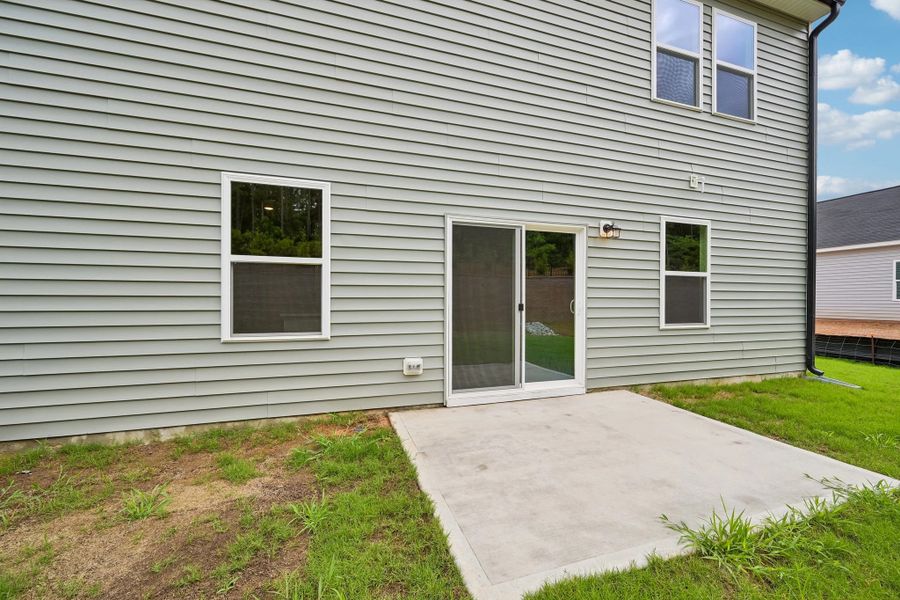 Exterior details and patio area of a home in Middleton Farms, Middlesex (Image 3).