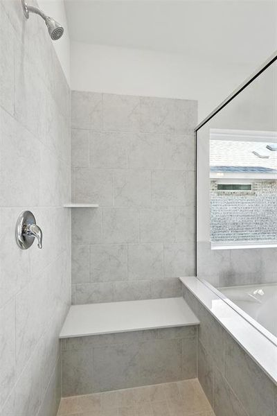 Full bathroom featuring tiled shower and a bathtub Full bathroom featuring tiled shower and a bathtub