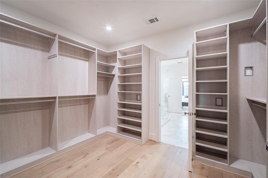 Custom California closet in Primary Bedroom.