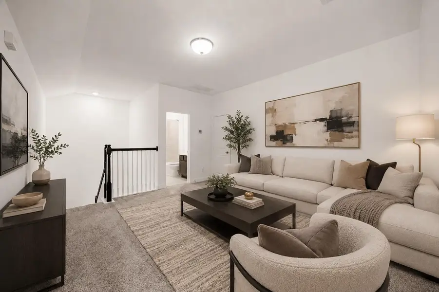 Enjoy the elegance of this virtually staged living area, featuring a cozy sectional, sophisticated decor, and warm lighting that creates an inviting atmosphere perfect for relaxation and entertainment.