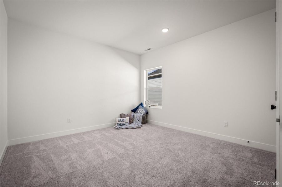 Spacious, unfurnished interior of a new home in Revel Crossing at Wolf Ranch - The Panorama Collection, Colorado Springs (Image 23).
