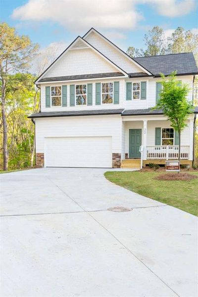 Front exterior of a new home in Creekside Landing, Dallas, GA, highlighting curb appeal (Image 2). Front exterior of a new home in Creekside Landing, Dallas, GA, highlighting curb appeal (Image 2).