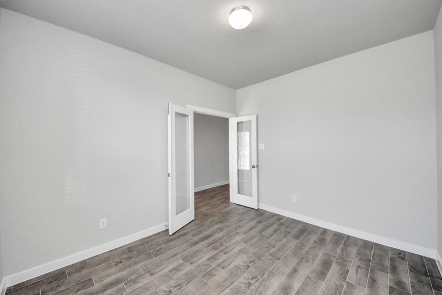 Quietly nestled in front of the home is the sophisticated home office. Featuring custom paint and large window with privacy blinds. Quietly nestled in front of the home is the sophisticated home office. Featuring custom paint and large window with privacy blinds.