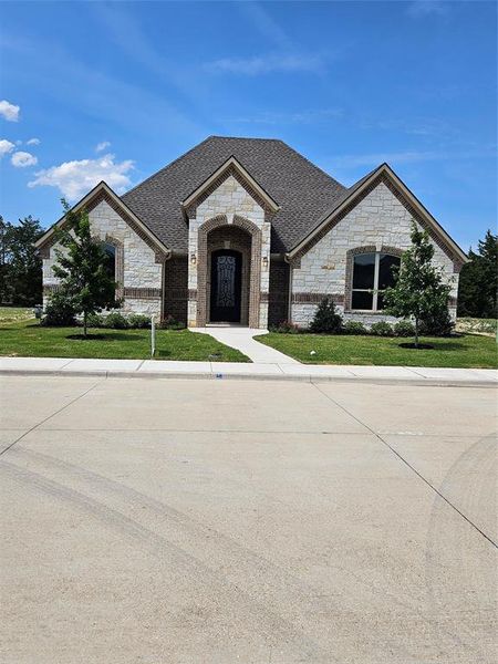 Front exterior of a new home in , Midlothian, TX, highlighting curb appeal (Image 1). Front exterior of a new home in , Midlothian, TX, highlighting curb appeal (Image 1).