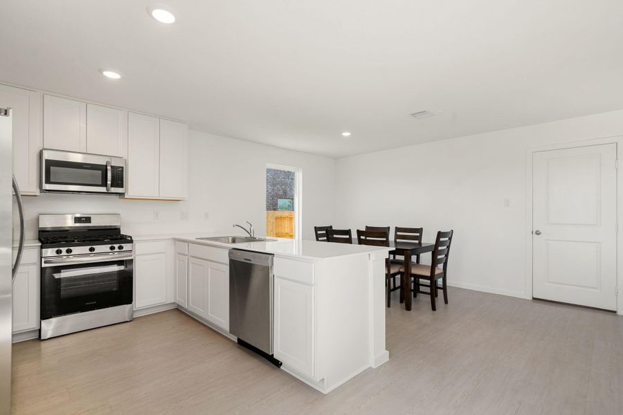 Furnished interior view inside a new home in Emberly: Cottage Collection, Beasley (Image 9).
