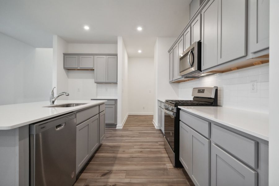 A kitchen with white cabinets. A kitchen with white cabinets.