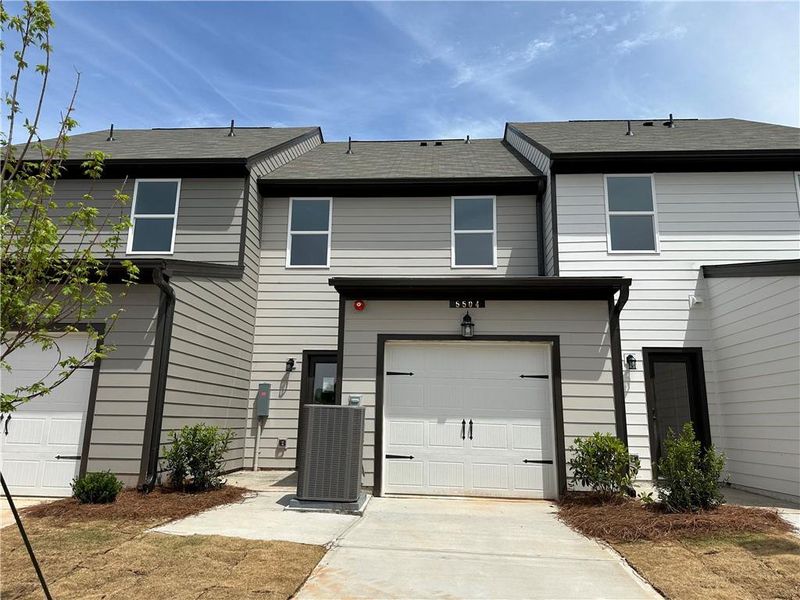 Front exterior of a new home in Laurelwood, Douglasville, GA, highlighting curb appeal (Image 9).