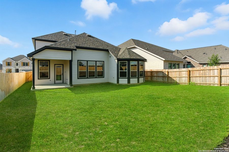 Front exterior of a new home in Legacy at Lake Dunlap, New Braunfels, TX, highlighting curb appeal (Image 1).