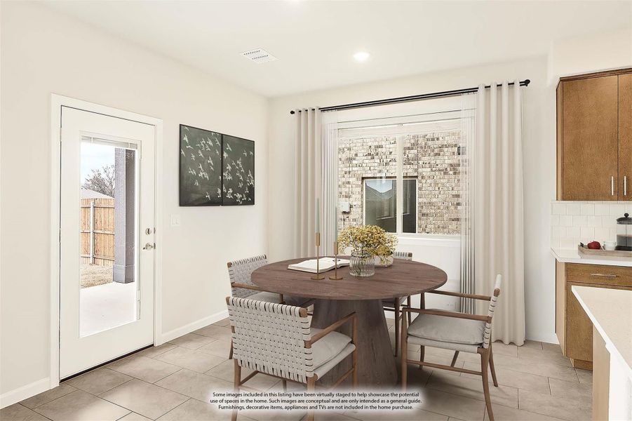 Breakfast nook with round wood table, four chairs, tile floors, and back door leading to fenced yard Breakfast nook with round wood table, four chairs, tile floors, and back door leading to fenced yard
