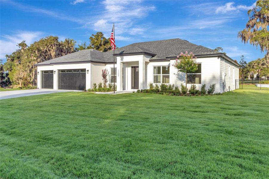 Front exterior of a new home in , Montverde, FL, highlighting curb appeal (Image 19). Front exterior of a new home in , Montverde, FL, highlighting curb appeal (Image 19).