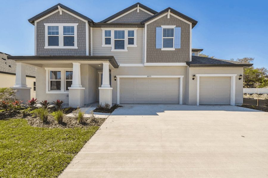 Representative exterior photo of a completed home built from the Sawgrass by William Ryan Homes in The Sanctuary – Royal Collection, Punta Gorda, FL (Image 26).