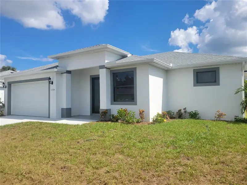 Front exterior of a new home in , Port Charlotte, FL, highlighting curb appeal (Image 2). Front exterior of a new home in , Port Charlotte, FL, highlighting curb appeal (Image 2).