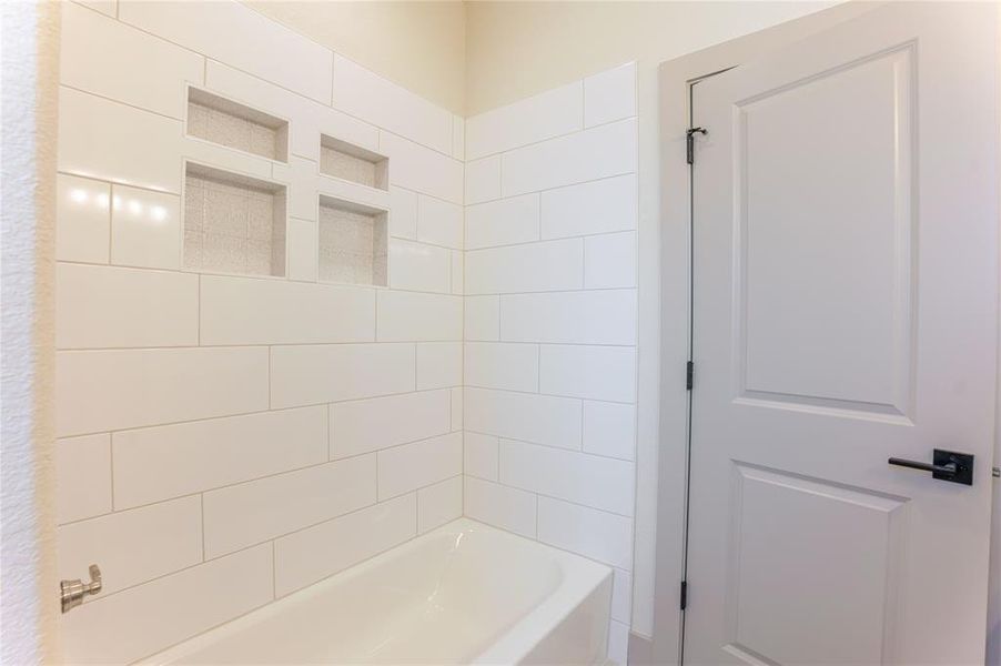 Secondary bathroom has full Shower/tub combo with an extra special tile touch. Secondary bathroom has full Shower/tub combo with an extra special tile touch.