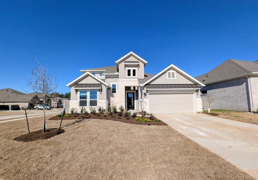 Front exterior of a new home in Artavia, Conroe, TX, highlighting curb appeal (Image 16).