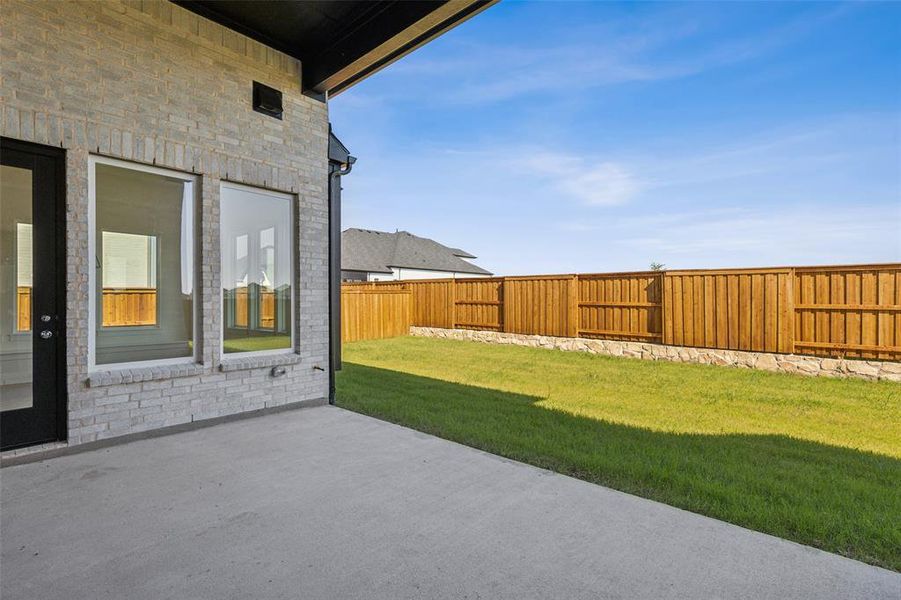 This wonderful covered back patio is the perfect place to relax and unwind!