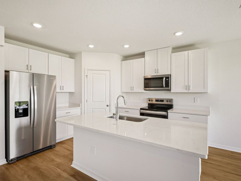 Furnished interior view inside a new home in The Grove at Stuart Crossing - Classic Series, Bartow (Image 6). Furnished interior view inside a new home in The Grove at Stuart Crossing - Classic Series, Bartow (Image 6).
