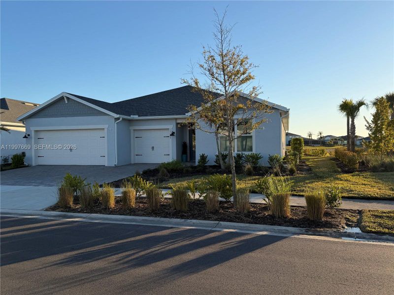 Front exterior of a new home in , Punta Gorda, FL, highlighting curb appeal (Image 20).
