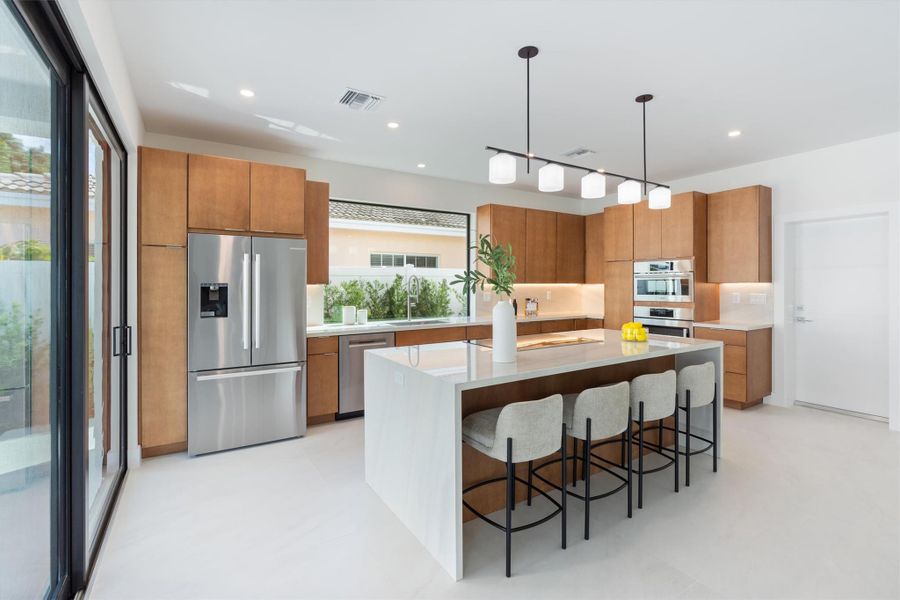 Large picture window at sink making kitchen open and airy