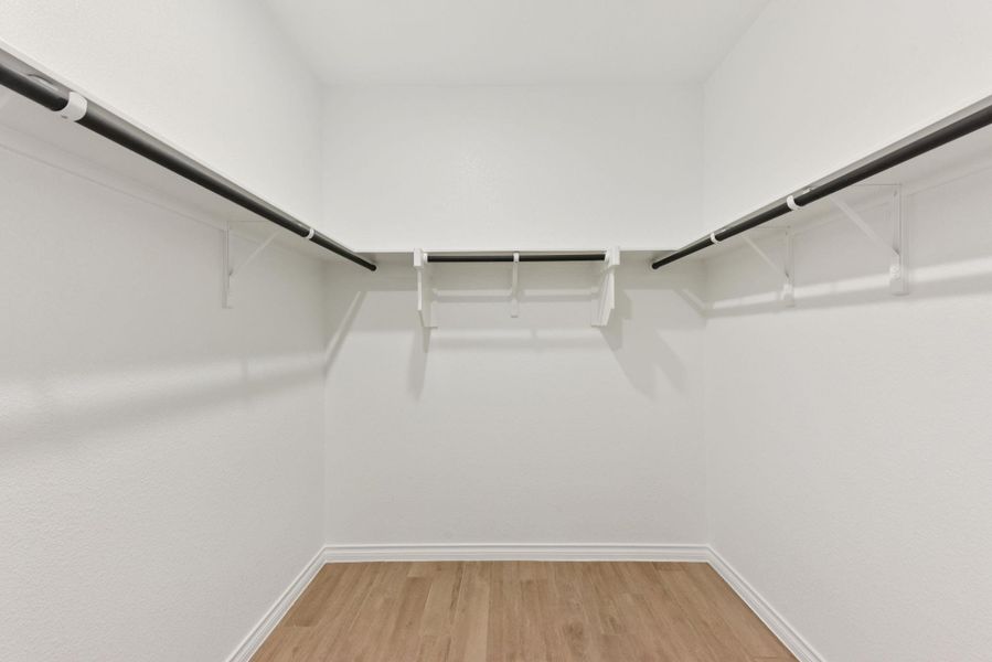Walk in closet featuring light wood-type flooring