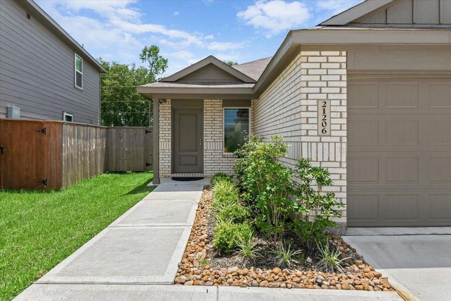 Exterior details and patio area of a home in Tavola, New Caney (Image 3).