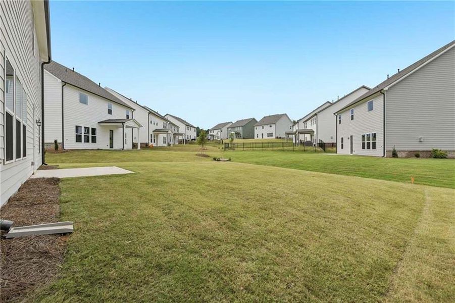 Exterior details and patio area of a home in East Harbor II at Chestatee, Dawsonville (Image 22).