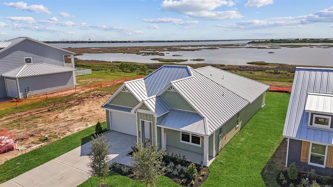 Front exterior of a new home in Grand Cay Harbour, Texas City, TX, highlighting curb appeal (Image 23). Front exterior of a new home in Grand Cay Harbour, Texas City, TX, highlighting curb appeal (Image 23).