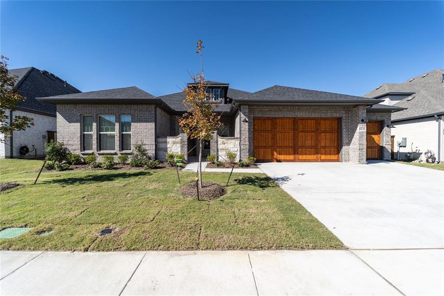 Front exterior of a new home in Sonoma Verde, Rockwall, TX, highlighting curb appeal (Image 2).