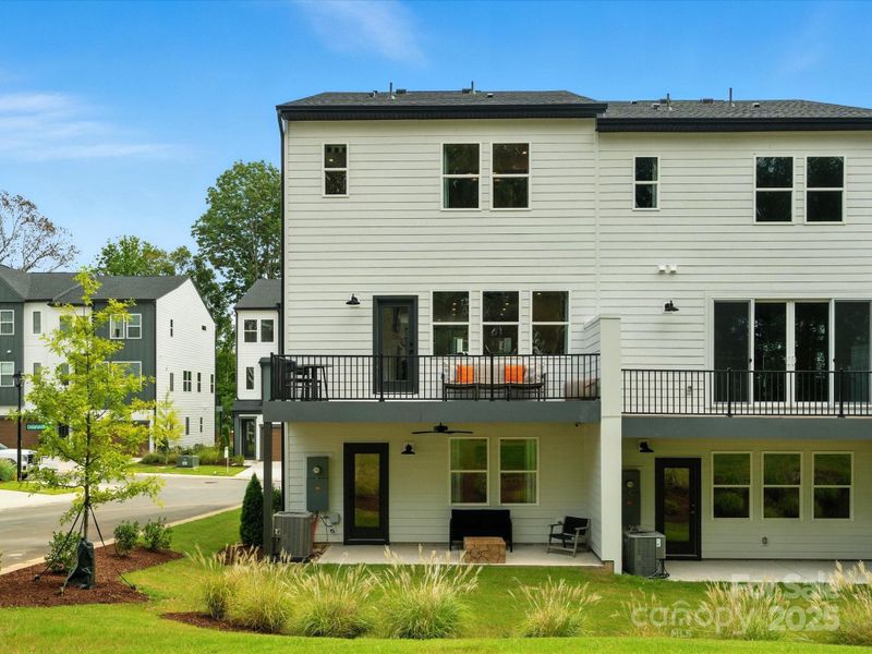 Rear Exterior and First Floor Covered Outdoor Living. *Model Photos | Actual Finishes, Structural Selection, and Orientation May Vary.