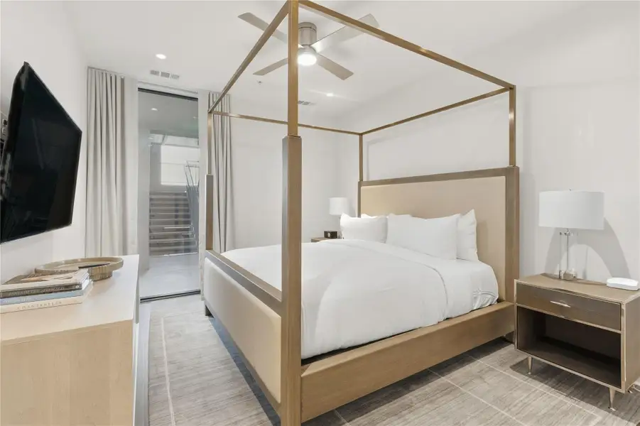 Bedroom with a ceiling fan, access to outside, and recessed lighting