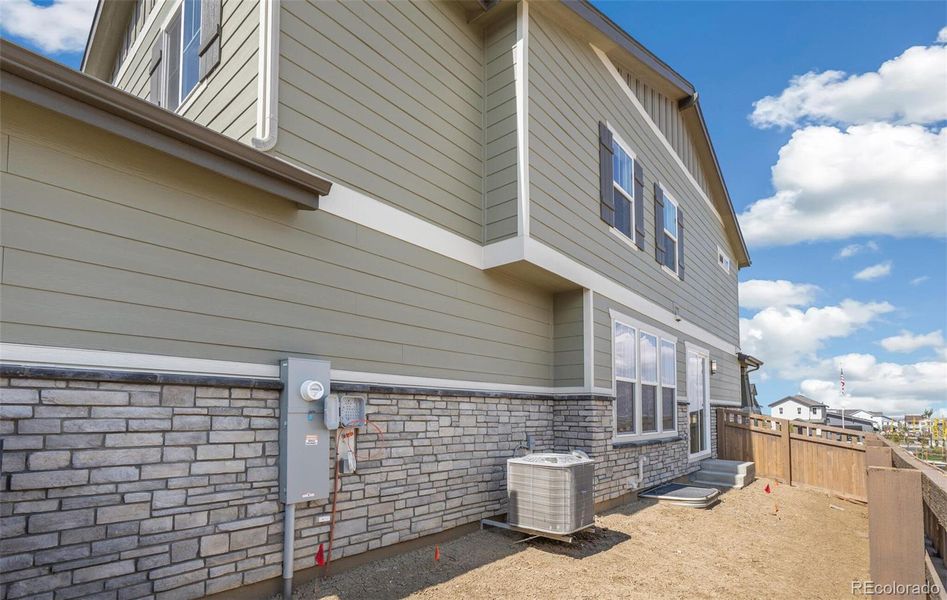 Exterior details and patio area of a home in Windler Villas, Aurora (Image 3).