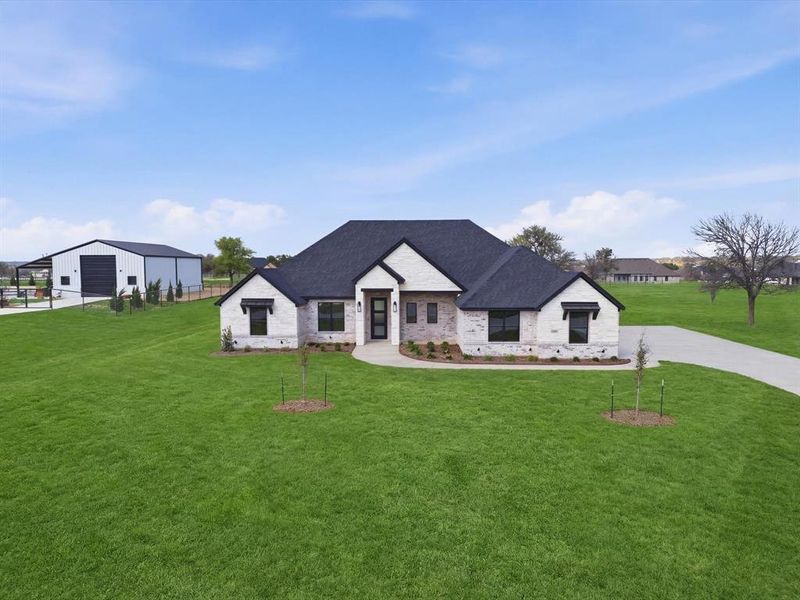 Front exterior of a new home in , Weatherford, TX, highlighting curb appeal (Image 22).