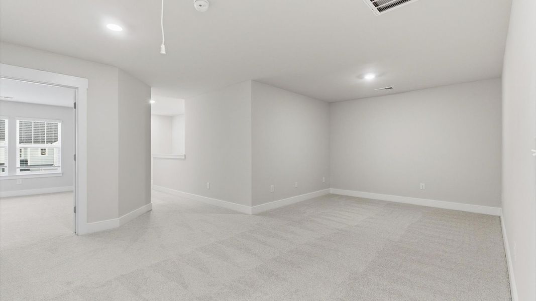 Memorable upstairs loft with plush carpeting and a bright, welcoming atmosphere Memorable upstairs loft with plush carpeting and a bright, welcoming atmosphere