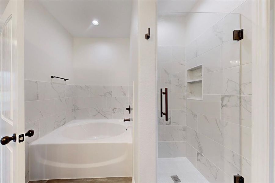 Bathroom featuring plus walk in shower