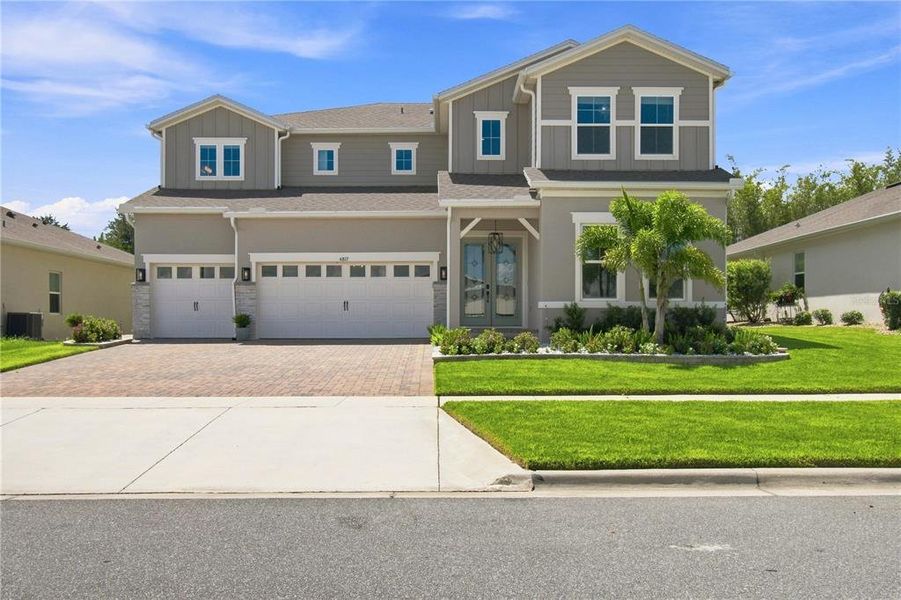 Front exterior of a new home in , Winter Garden, FL, highlighting curb appeal (Image 27).